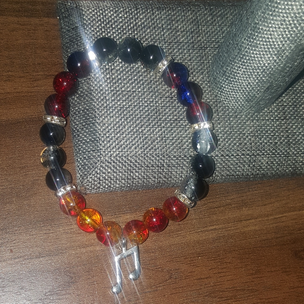 Handmade Glass beaded bracelet with a charm
